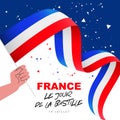 Human hand is holding a French flag. Bastille Day on July 14 - inscription in French. National holiday in France Royalty Free Stock Photo