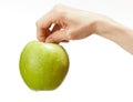 Human hand holding fresh green apple Royalty Free Stock Photo
