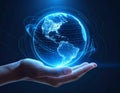 Human hand holding glowing digital Earth globe with network connection lines on a dark background Royalty Free Stock Photo