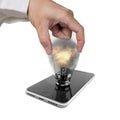 Human hand holding glowing light bulb inserted in smart phone Royalty Free Stock Photo