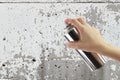 Human hand holding a graffiti Spray can Royalty Free Stock Photo