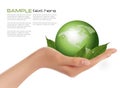 Human hand holding green globe with leaves. Royalty Free Stock Photo