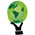 Human hand holding green globe with leaves. Royalty Free Stock Photo