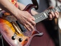 Human hand holding guitar music instrument Royalty Free Stock Photo