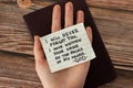 Human hand holding handwritten Bible quote about God Jesus Christ`s love Royalty Free Stock Photo