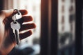 Human Hand Holding Keys. Real estate agent handing over house keys in hand. Close-up view of keys Royalty Free Stock Photo