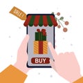 Human hand holding mobile phone with application for shopping to Christmas. Male hands buying and ordering presents in