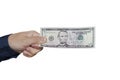 Human hand holding money, sharing 5 dollar banknotes. Isolated on white background. Royalty Free Stock Photo