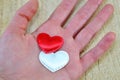 Human hand holding two hearts Royalty Free Stock Photo