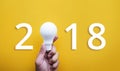 2018 Ideas creativity concept with human hand holding light bulb Royalty Free Stock Photo