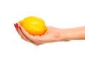 Human hand holding yellow lemon Royalty Free Stock Photo