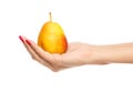 Human hand holding yellow pear Royalty Free Stock Photo