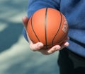 The human hand holds the ball. Royalty Free Stock Photo