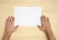 Human hand holds a blank paper Royalty Free Stock Photo