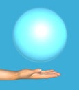 Human hand holds a blue ball. Royalty Free Stock Photo