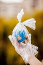 The human hand holds the planet earth in a plastic bag. The concept of pollution by plastic debris. Global warming due to Royalty Free Stock Photo