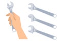 Human hand holds wrench. Adjustable spanner set.