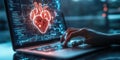 Human hand interacting with digital heart visualization on a laptop, highlighting advanced medical technology and Royalty Free Stock Photo