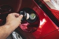 Human hand is open or close fuel tank cap Royalty Free Stock Photo