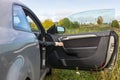 Human hand opens the car door In the countryside Royalty Free Stock Photo
