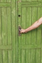 The human hand opens a closed door vintage Royalty Free Stock Photo