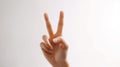 Human hand with a peace sign