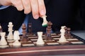 Human hand playing chess Royalty Free Stock Photo