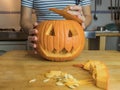 Human hand preparing pumpkin Royalty Free Stock Photo