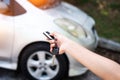 The human hand is pressing button on car remote control key,for open the car,warm light tone Royalty Free Stock Photo