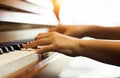 The human hand is pressing on piano keys,show how to play piano song