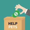 Human hand putting paper money bill with dollar sign into donation paper cardboard box. Helping hands concept. Donate and help pet Royalty Free Stock Photo