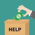 Human hand putting paper money bill with dollar sign into donation paper cardboard box. Helping hands concept. Help and donate Royalty Free Stock Photo