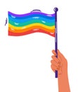 Human hand rainbow flag. Pride month or day celebration or parade.