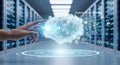 Futuristic digital cloud interacting with human hand amidst rows of glowing server racks Royalty Free Stock Photo