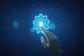 Human hand touching glowing blue digital gear interface on circuit board background technology automation Royalty Free Stock Photo