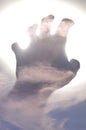 Human hand reaching out to heavenly sky Royalty Free Stock Photo