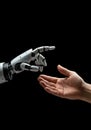 Human hand reaching out to robotic hand against black background Royalty Free Stock Photo