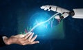 Human Hand Reaching for a Robotic Hand with Stock Market Data Visuals in the Background Impute Royalty Free Stock Photo