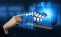Human hand reaching towards robotic hand interacting with digital graphs and charts on laptop display in a futuristic Royalty Free Stock Photo