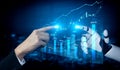 Human Hand and Robot Hand Interacting with Digital Financial Data and Graphs Representing Technology Integration in Royalty Free Stock Photo