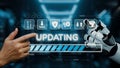Human Hand Interacting with Robotic Hand During Software Update in a Modern Digital Environment. Auvana Royalty Free Stock Photo