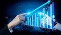 Human Hand and Robotic Hand Interacting with Data Visualization and Graph Showing Upward Trend in Business and Royalty Free Stock Photo