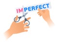 Human hand with a scissors cuts a phrase IMPERFECT