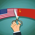 Human hand with scissors cuts the USA flag and the USSR. Cold Wa Royalty Free Stock Photo