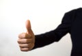 Human hand showing thumbs up on the white foreground Royalty Free Stock Photo