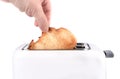 Human hand takes out toasted bread toast from a toaster Royalty Free Stock Photo