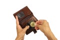 human hand takes or puts golden coin of bitcoin from brown leather wallet, isolated Royalty Free Stock Photo