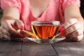 Human hand taking cookie in plate on a table Royalty Free Stock Photo