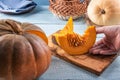 Taking fresh pumpkin slices with seeds by hand Royalty Free Stock Photo