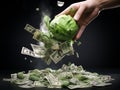 Human hand throwing money into a green cabbage. Concept of saving money.